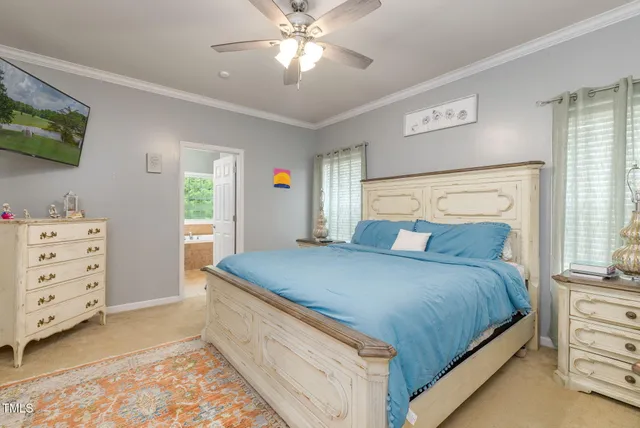 a kitchen with stainless steel appliances kitchen island granite countertop a refrigerator a stove top oven a sink dishwasher and white cabinets with wooden floor