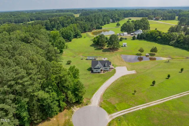a view of a garden with houses