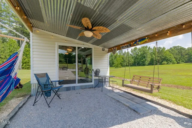 a view of a deck with a table and chairs