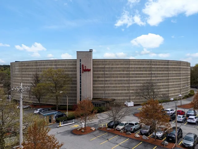 a view of parking area with parked cars