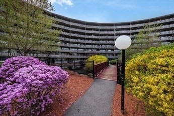 200 Swanton Street, Unit 234 Winchester, MA 01890 - Photo 13 of 17 a front view of a house with a garden