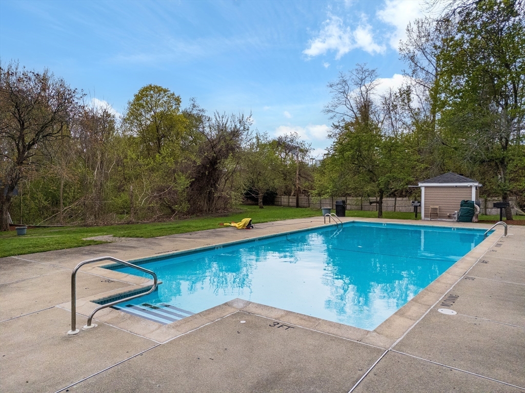 200 Swanton Street, Unit 234 Winchester, MA 01890 - Photo 16 of 17 a view of a swimming pool with a lounge chair