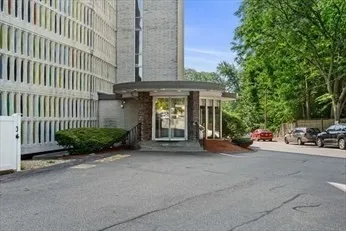 a view of a car park in front of a building