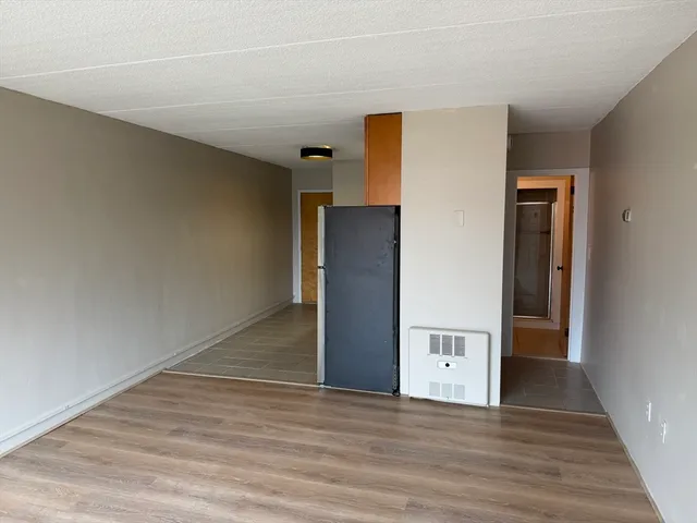 a view of a livingroom with wooden floor