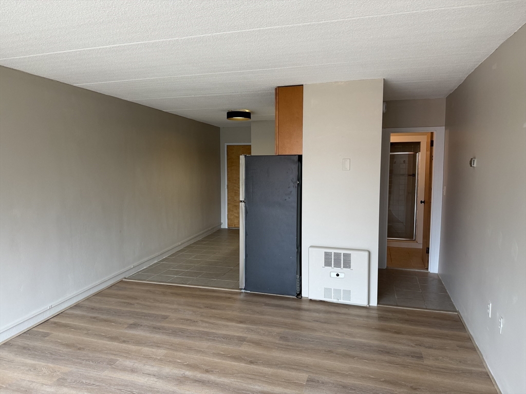 200 Swanton Street, Unit 234 Winchester, MA 01890 - Photo 6 of 17 a view of a livingroom with wooden floor