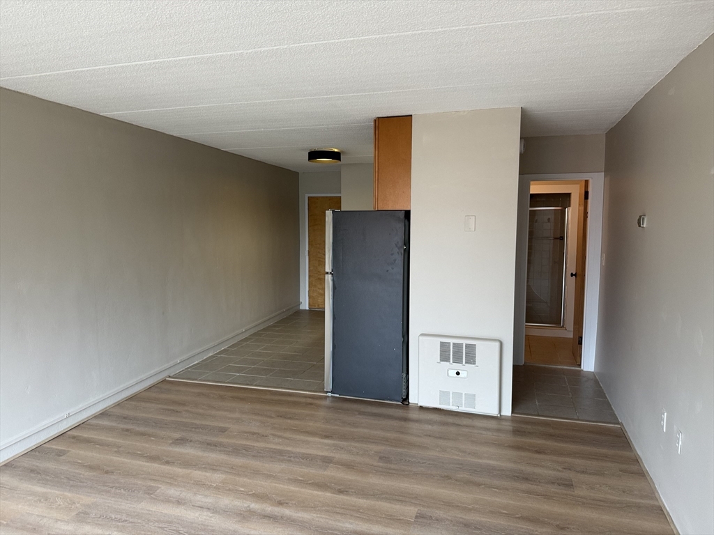 200 Swanton Street, Unit 234 Winchester, MA 01890 - Photo 7 of 17 a view of a livingroom with wooden floor and staircase