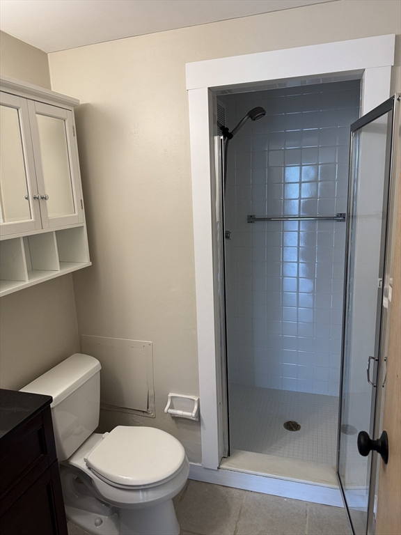 200 Swanton Street, Unit 234 Winchester, MA 01890 - Photo 9 of 17 a white toilet sitting next to a bathroom sink