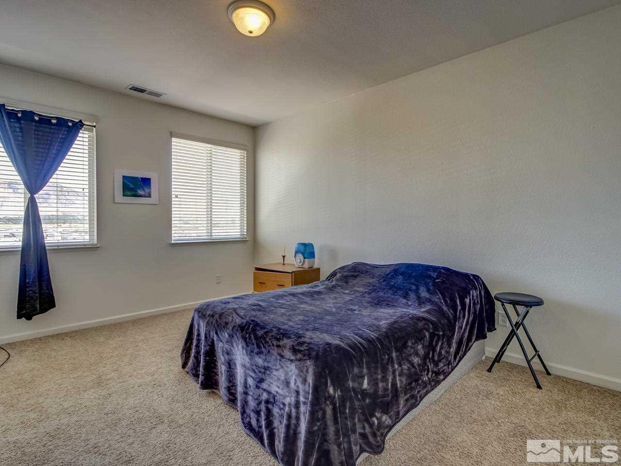 2160 Hellaby Lane Reno, NV 89502 - Photo 7 of 14 a bedroom with a bed and window