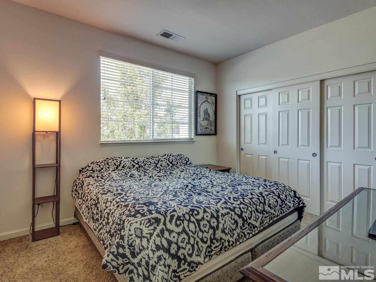 2160 Hellaby Lane Reno, NV 89502 - Photo 10 of 14 a bedroom with a bed and a window