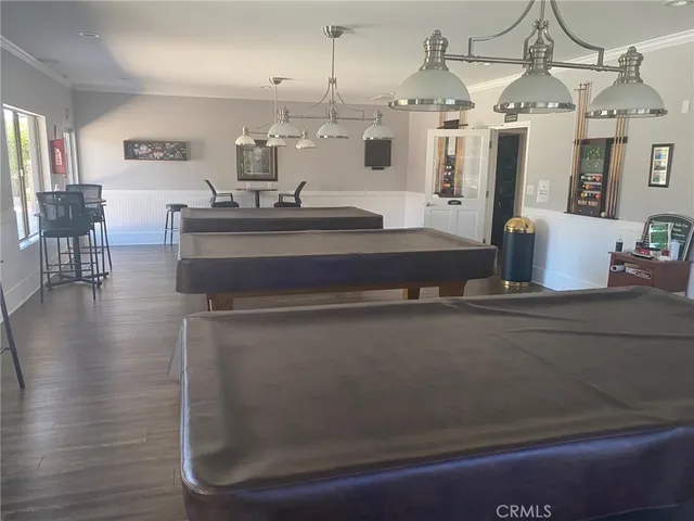 a view of living room with granite countertop furniture and wooden floor