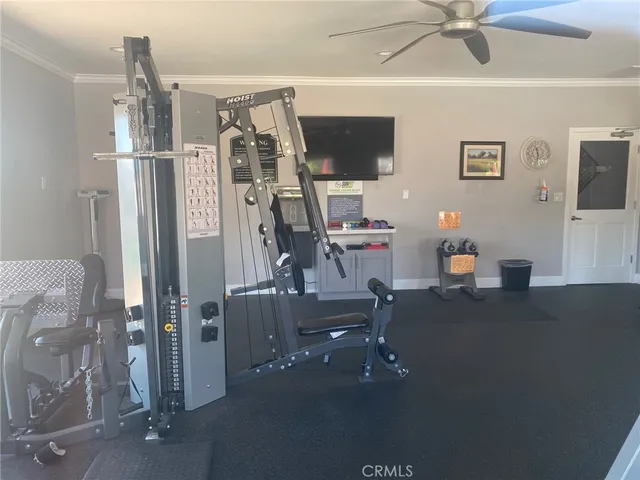 a view of a livingroom with furniture and a ceiling fan