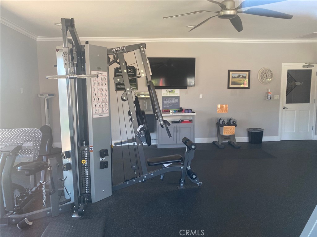 10210 Base Line Road, Unit 289 Alta Loma, CA 91701 - Photo 21 of 25 a view of a livingroom with furniture and a ceiling fan