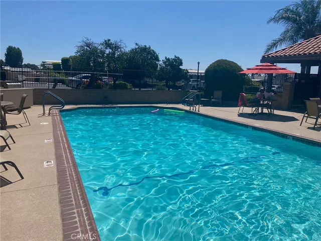 a view of a backyard with sitting area
