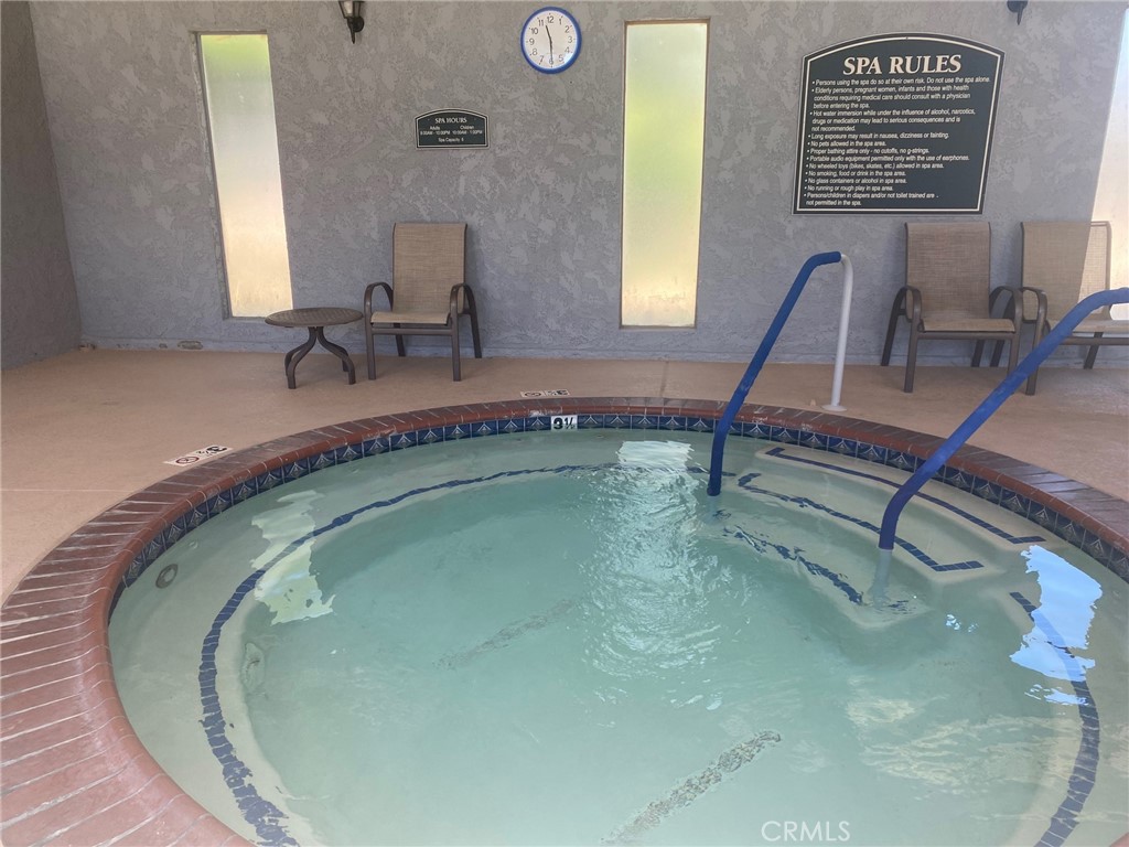 10210 Base Line Road, Unit 289 Alta Loma, CA 91701 - Photo 23 of 25 a bathroom with a sink and a mirror