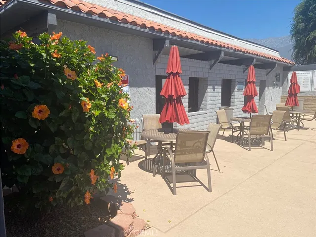 a view of dinning table and chairs in the patio