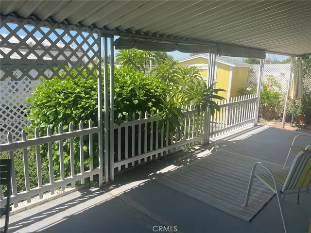 a view of balcony with wooden floor