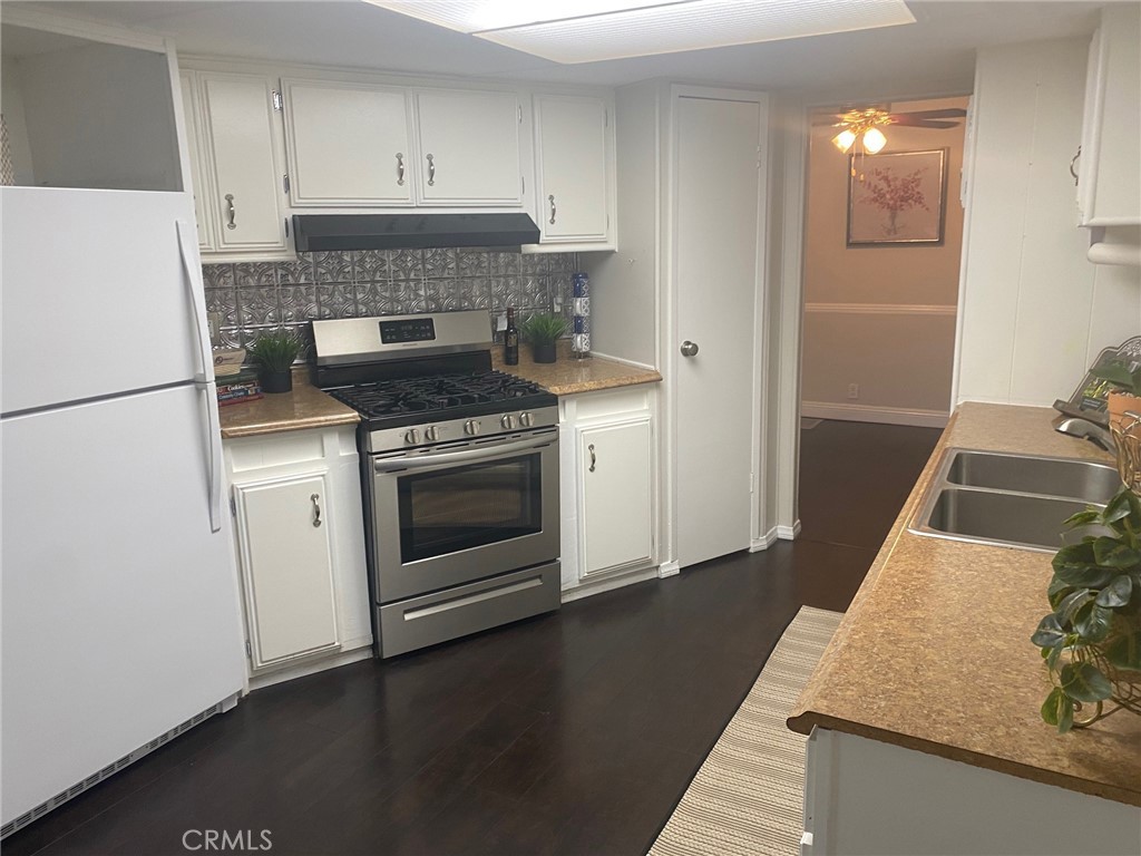 10210 Base Line Road, Unit 289 Alta Loma, CA 91701 - Photo 9 of 25 a kitchen with a stove and a refrigerator