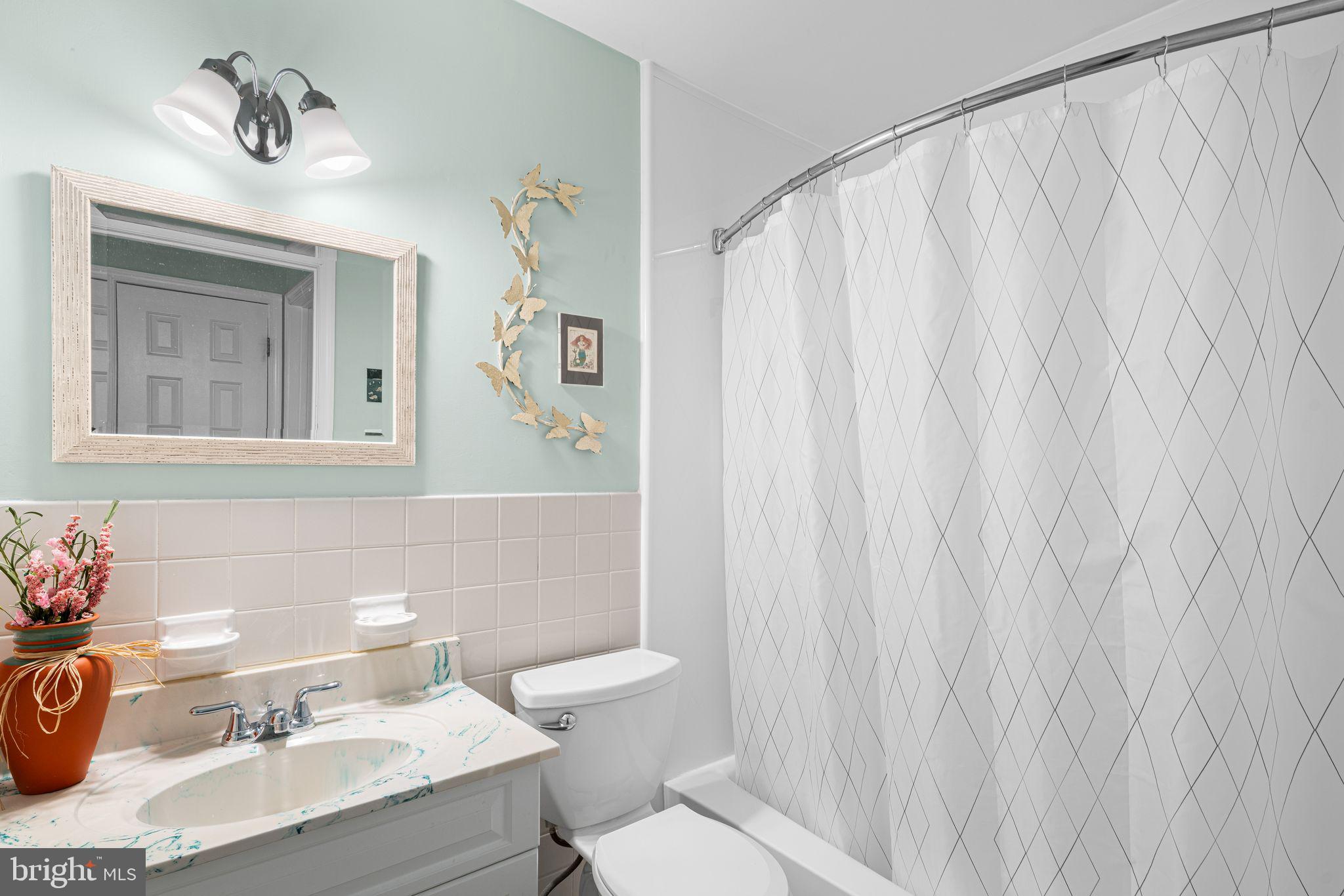 333 South Atlantic Avenue Haddonfield, NJ 08033 - Photo 12 of 19 a bathroom with a sink and a mirror