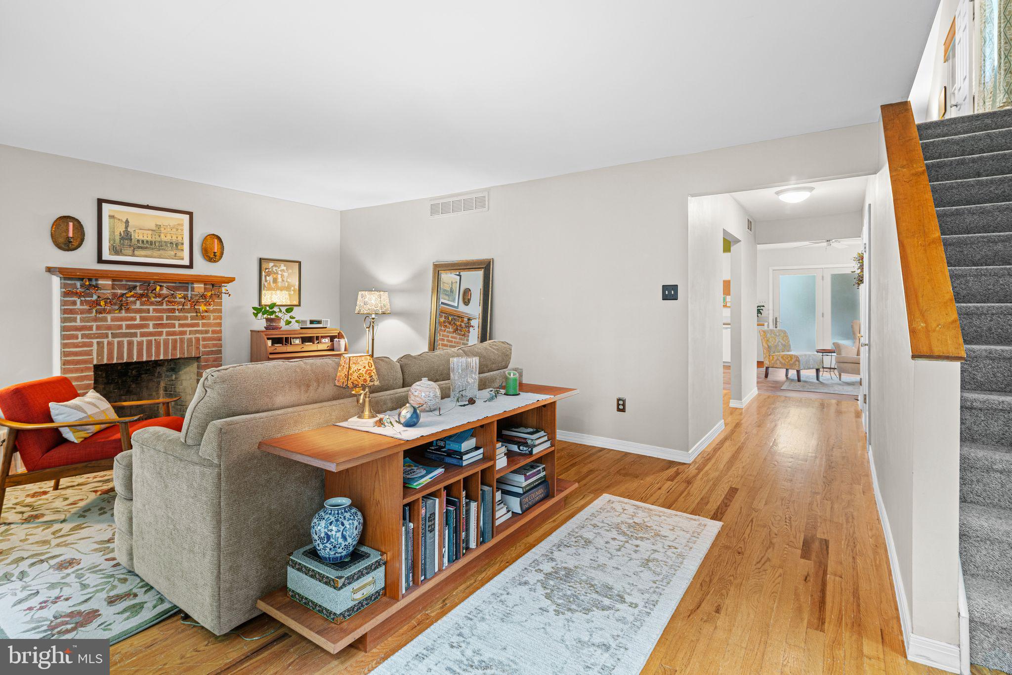 333 South Atlantic Avenue Haddonfield, NJ 08033 - Photo 2 of 19 a living room with fireplace furniture and a rug