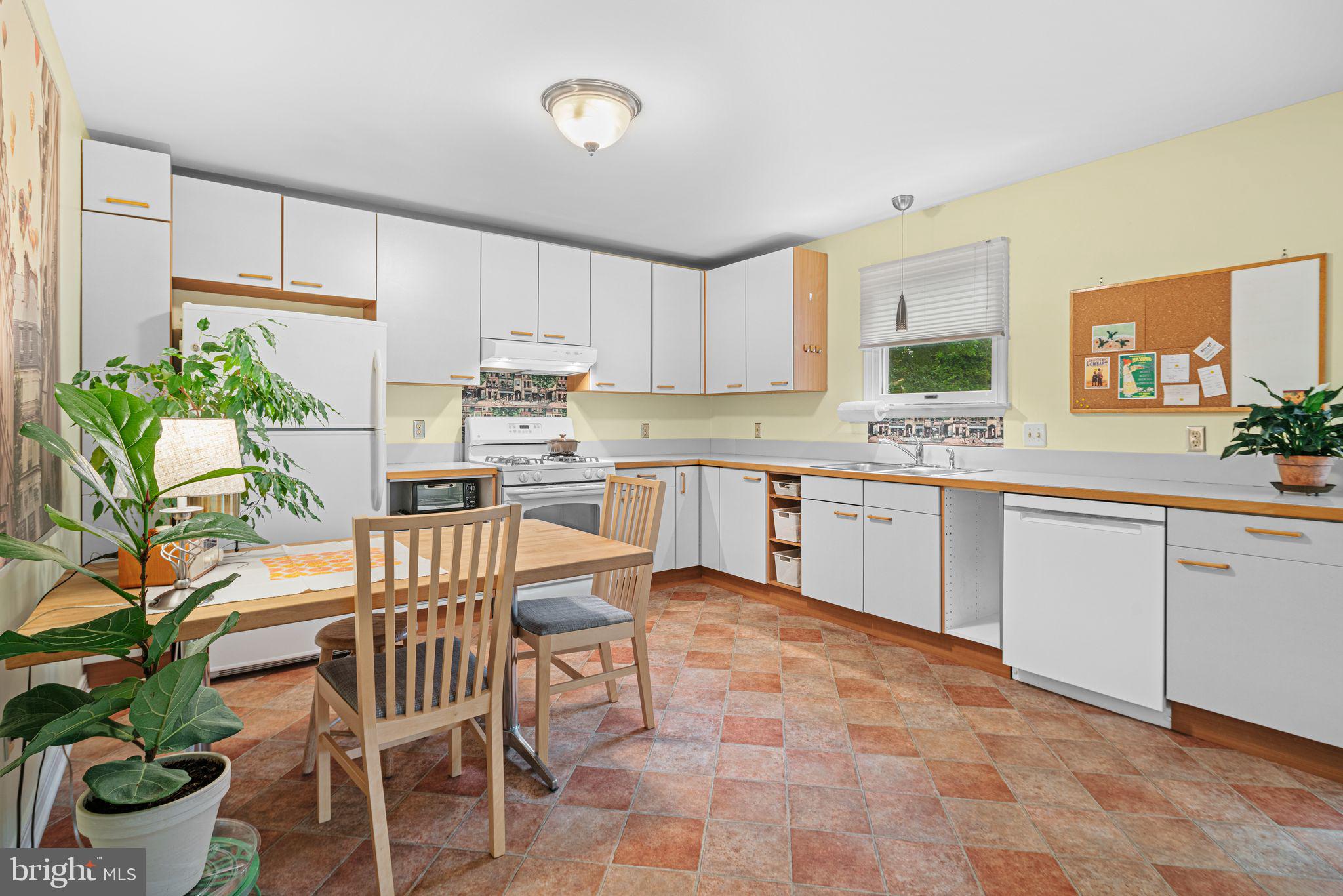333 South Atlantic Avenue Haddonfield, NJ 08033 - Photo 6 of 19 a kitchen with a table and chairs in it