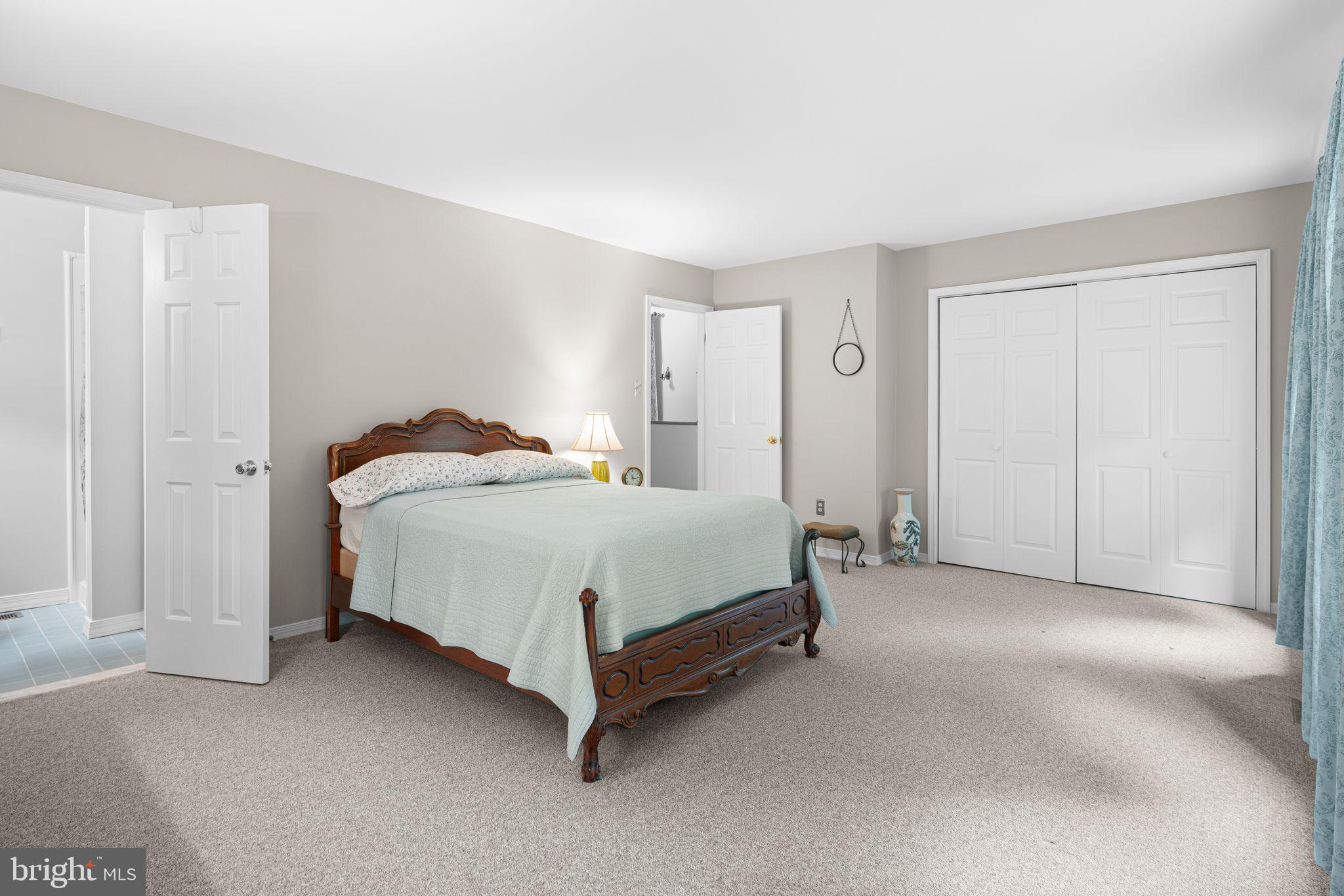 333 South Atlantic Avenue Haddonfield, NJ 08033 - Photo 10 of 19 a spacious bedroom with a bed and a cabinets