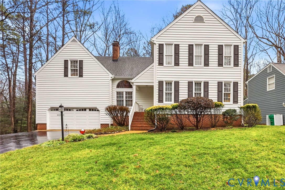 5601 Sandstone Ridge Road Midlothian, VA 23112 - Photo 1 of 43 front view of a house and a yard