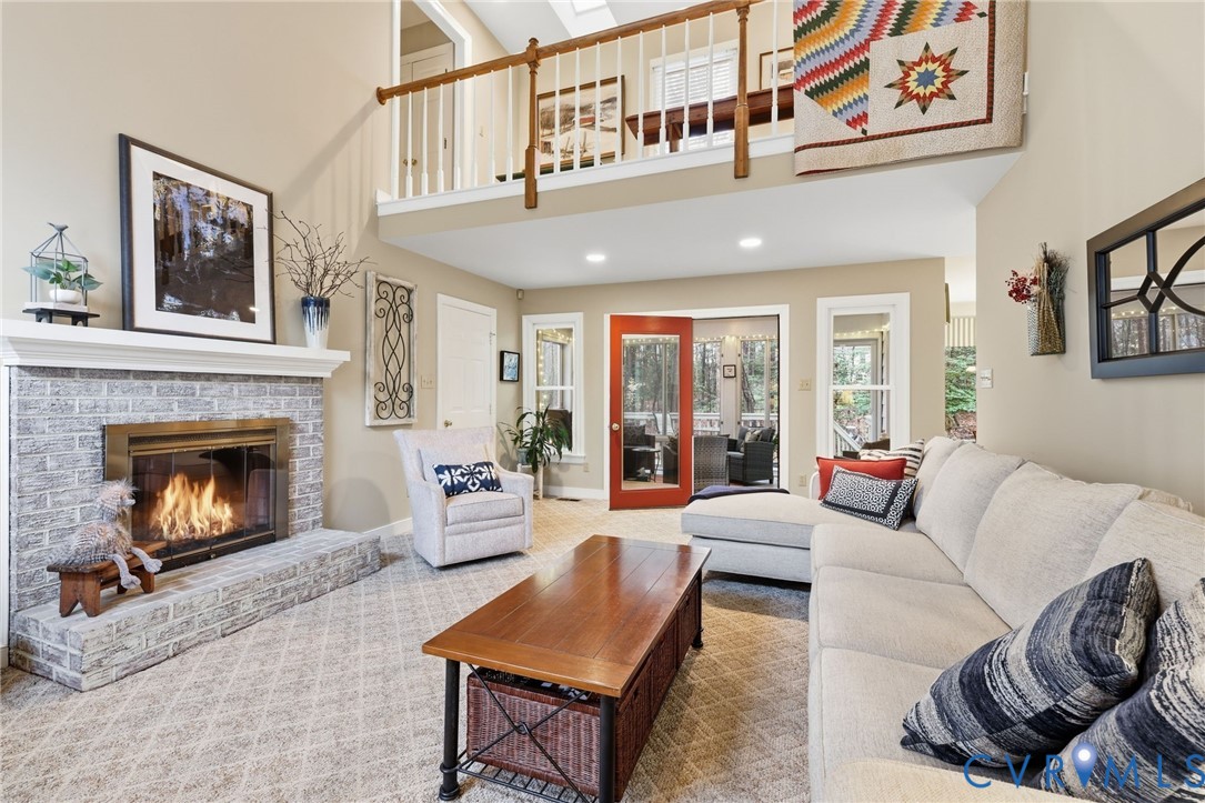 5601 Sandstone Ridge Road Midlothian, VA 23112 - Photo 14 of 43 a living room with furniture and a fireplace
