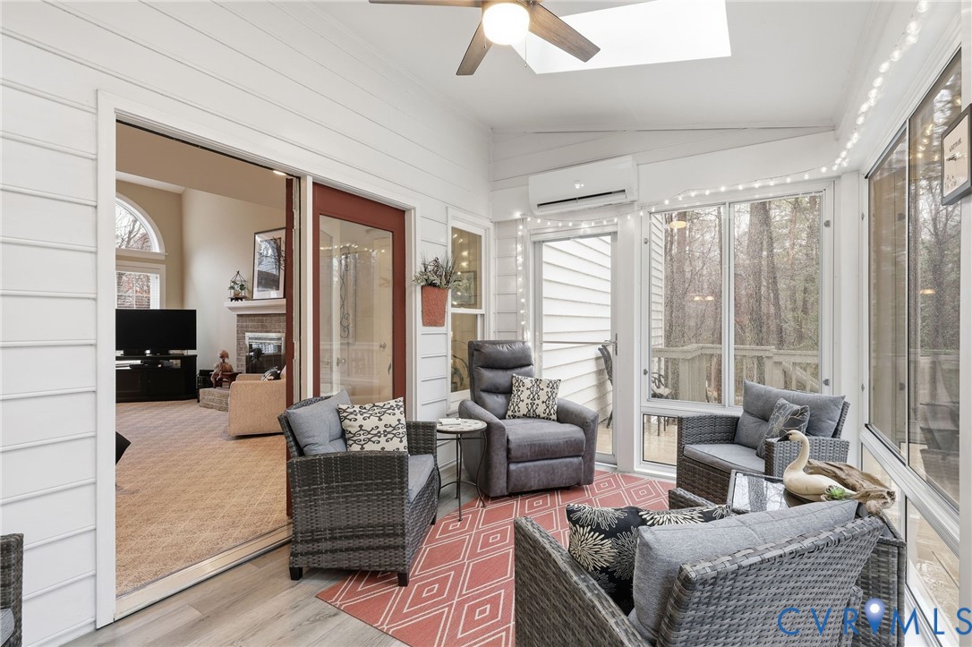 5601 Sandstone Ridge Road Midlothian, VA 23112 - Photo 17 of 43 a living room with furniture and a large window