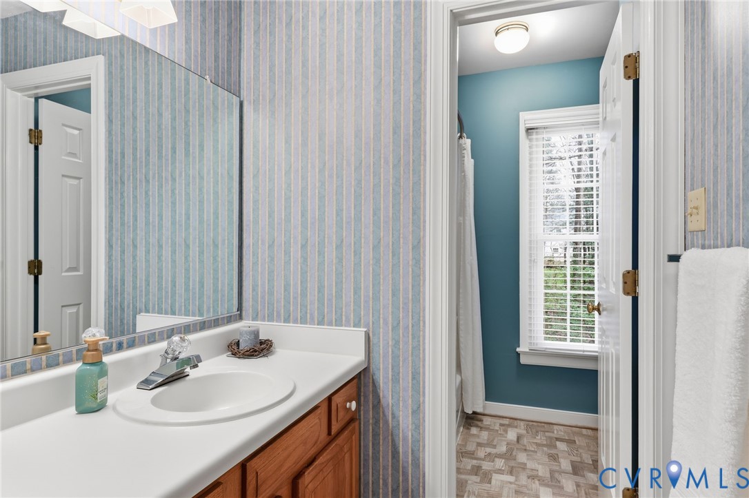 5601 Sandstone Ridge Road Midlothian, VA 23112 - Photo 32 of 43 a bathroom with a sink and a mirror