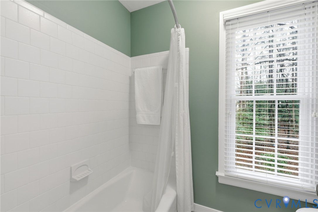 5601 Sandstone Ridge Road Midlothian, VA 23112 - Photo 33 of 43 a bathroom with a bathtub and a shower