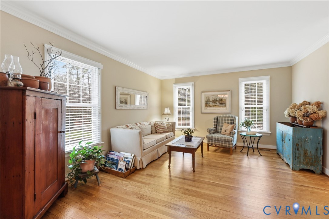 5601 Sandstone Ridge Road Midlothian, VA 23112 - Photo 6 of 43 a living room with furniture and wooden floor