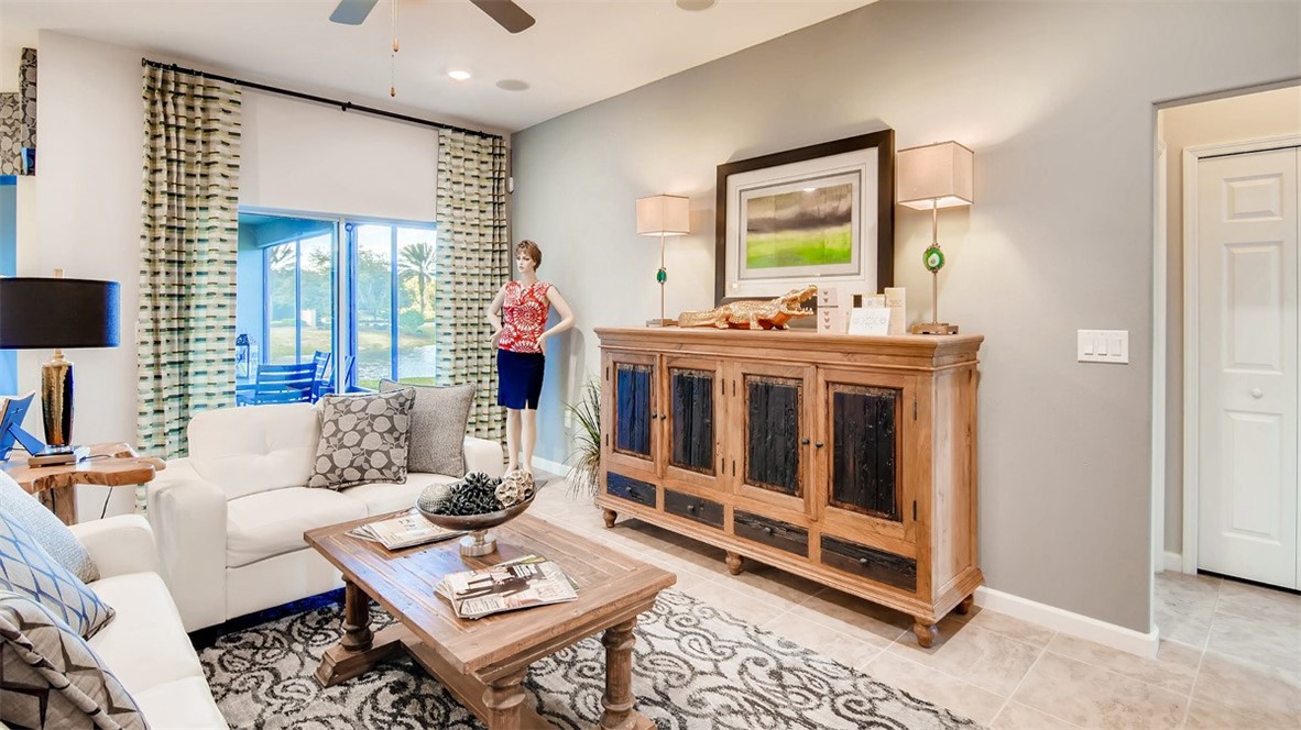 71 52nd Square Vero Beach, FL 32968 - Photo 5 of 16 a living room with furniture and a window