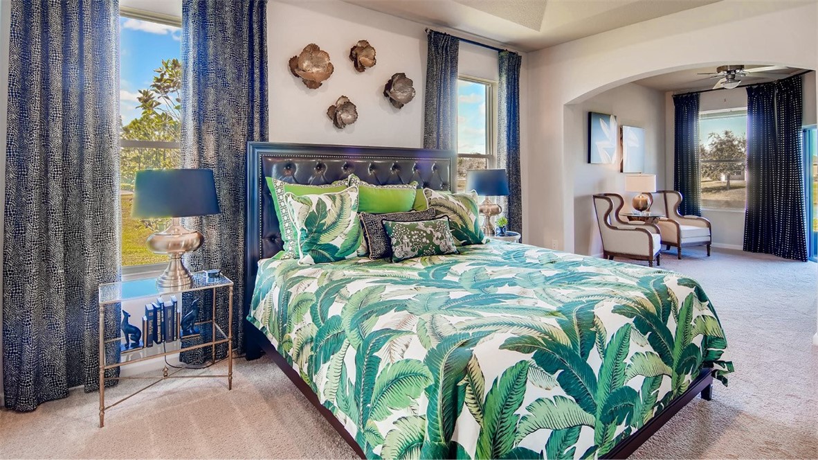 71 52nd Square Vero Beach, FL 32968 - Photo 6 of 16 a bedroom with a bed and painting on the wall