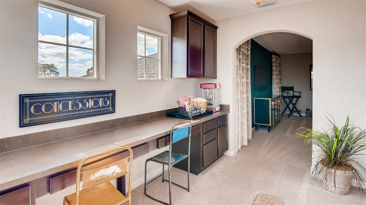 71 52nd Square Vero Beach, FL 32968 - Photo 8 of 16 a kitchen that has a lot of cabinets and wooden floor