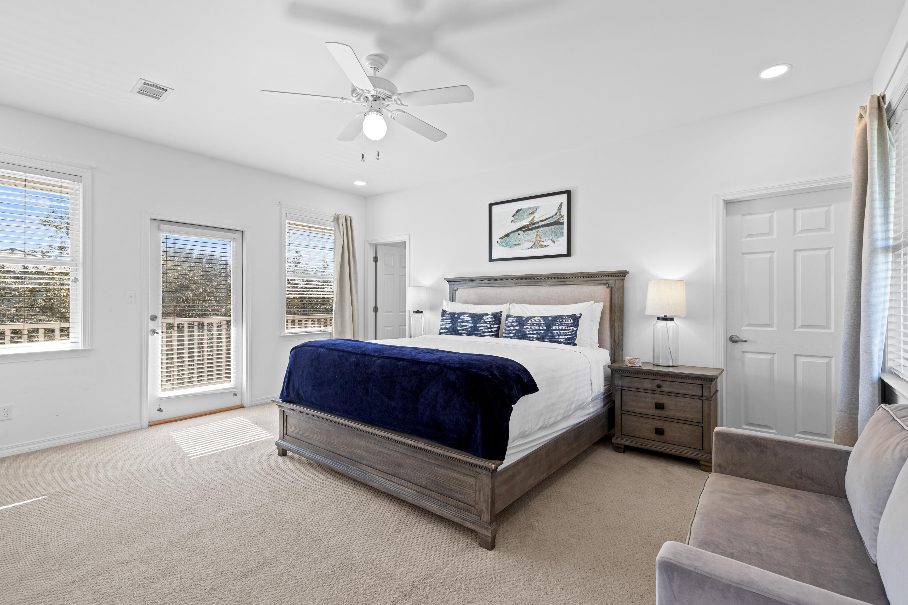 19 Buddy Street Santa Rosa Beach, FL 32459 - Photo 16 of 23 a spacious bedroom with a bed a couch and a window