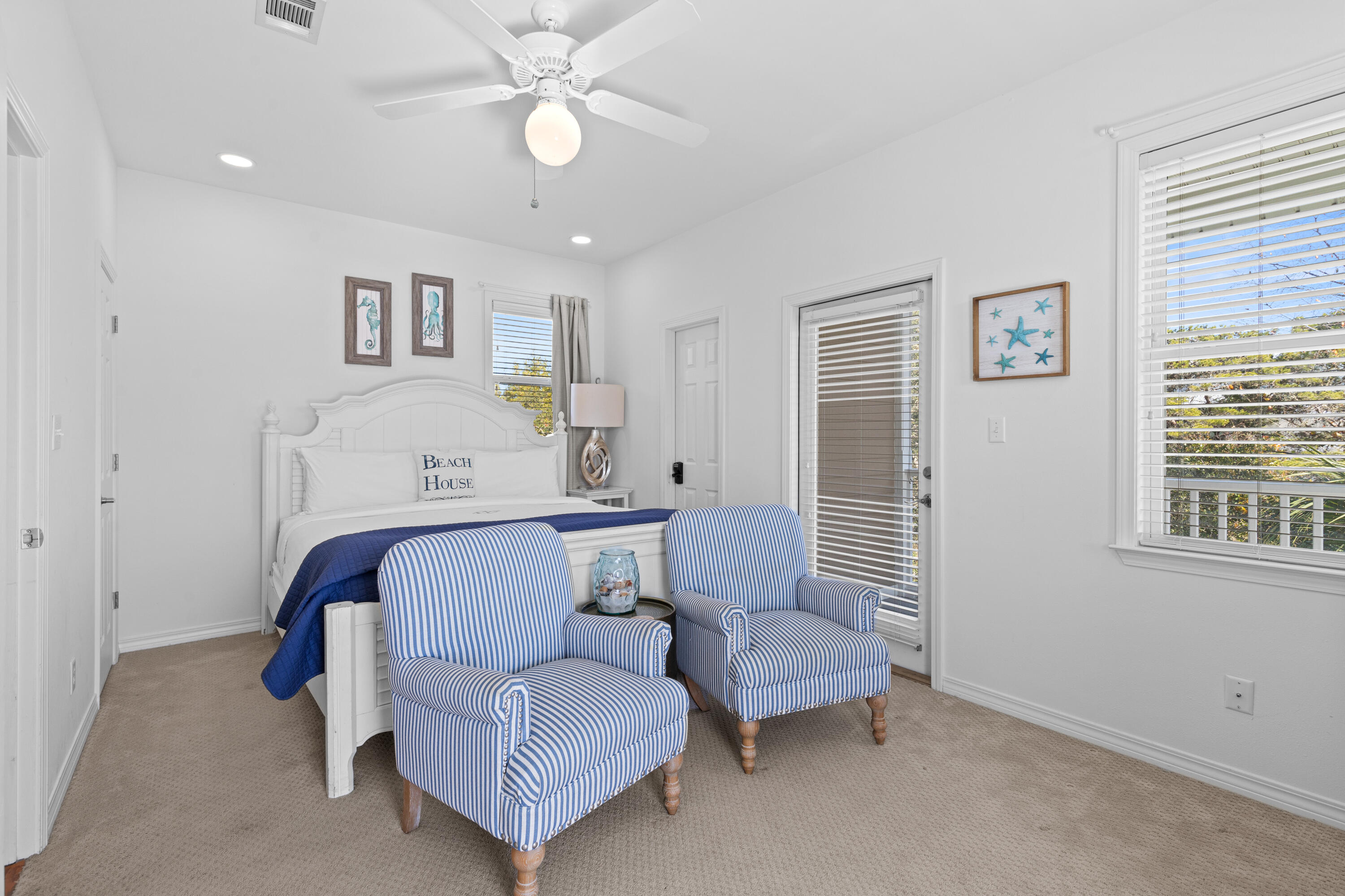 19 Buddy Street Santa Rosa Beach, FL 32459 - Photo 17 of 23 a bedroom with a bed and a chandelier