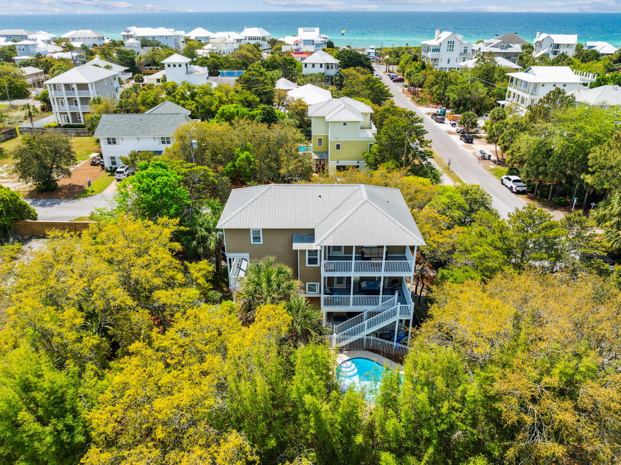19 Buddy Street Santa Rosa Beach, FL 32459 - Photo 2 of 23 a aerial view of a house with swimming pool and large trees