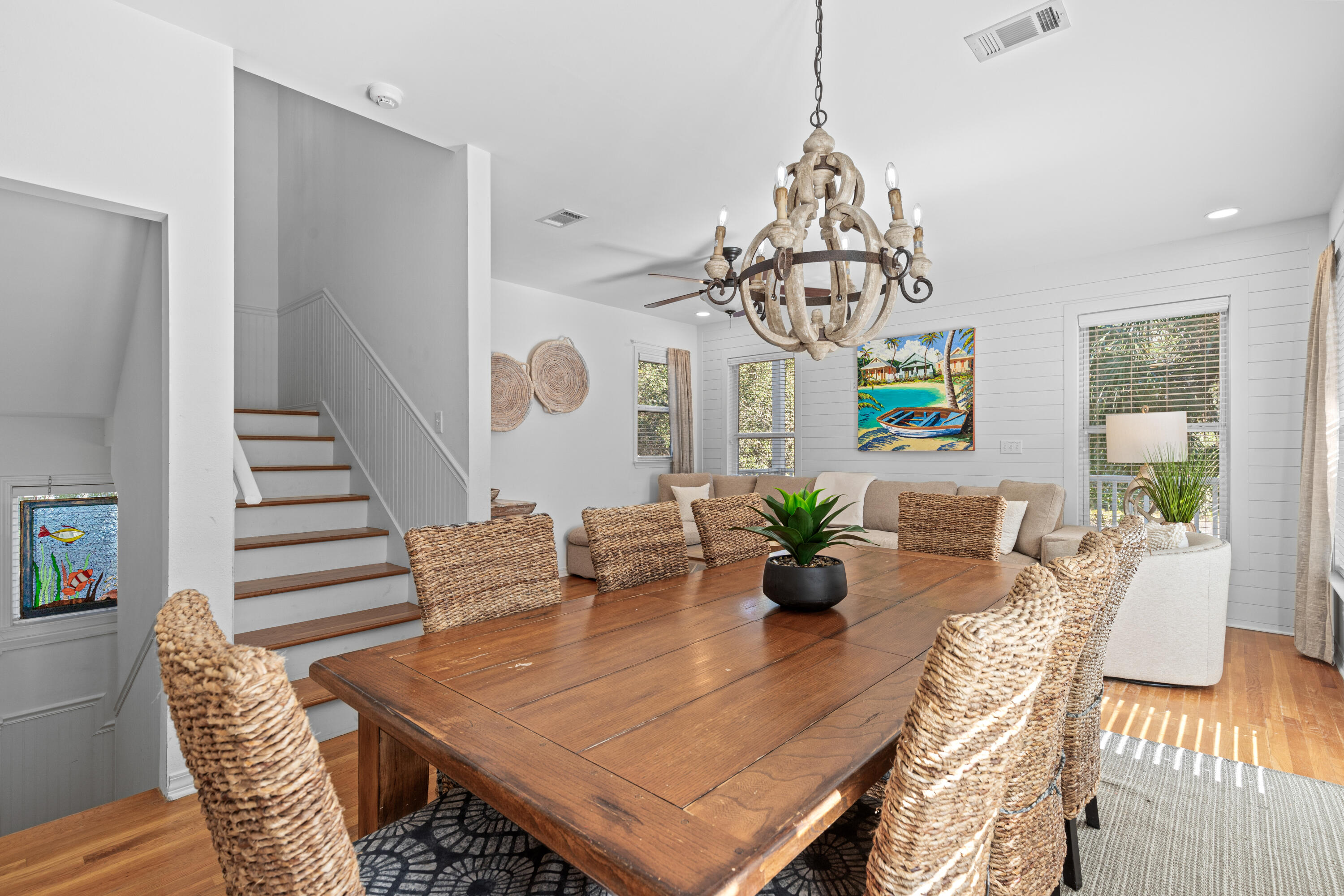 19 Buddy Street Santa Rosa Beach, FL 32459 - Photo 7 of 23 a view of a dining room with furniture a chandelier and wooden floor