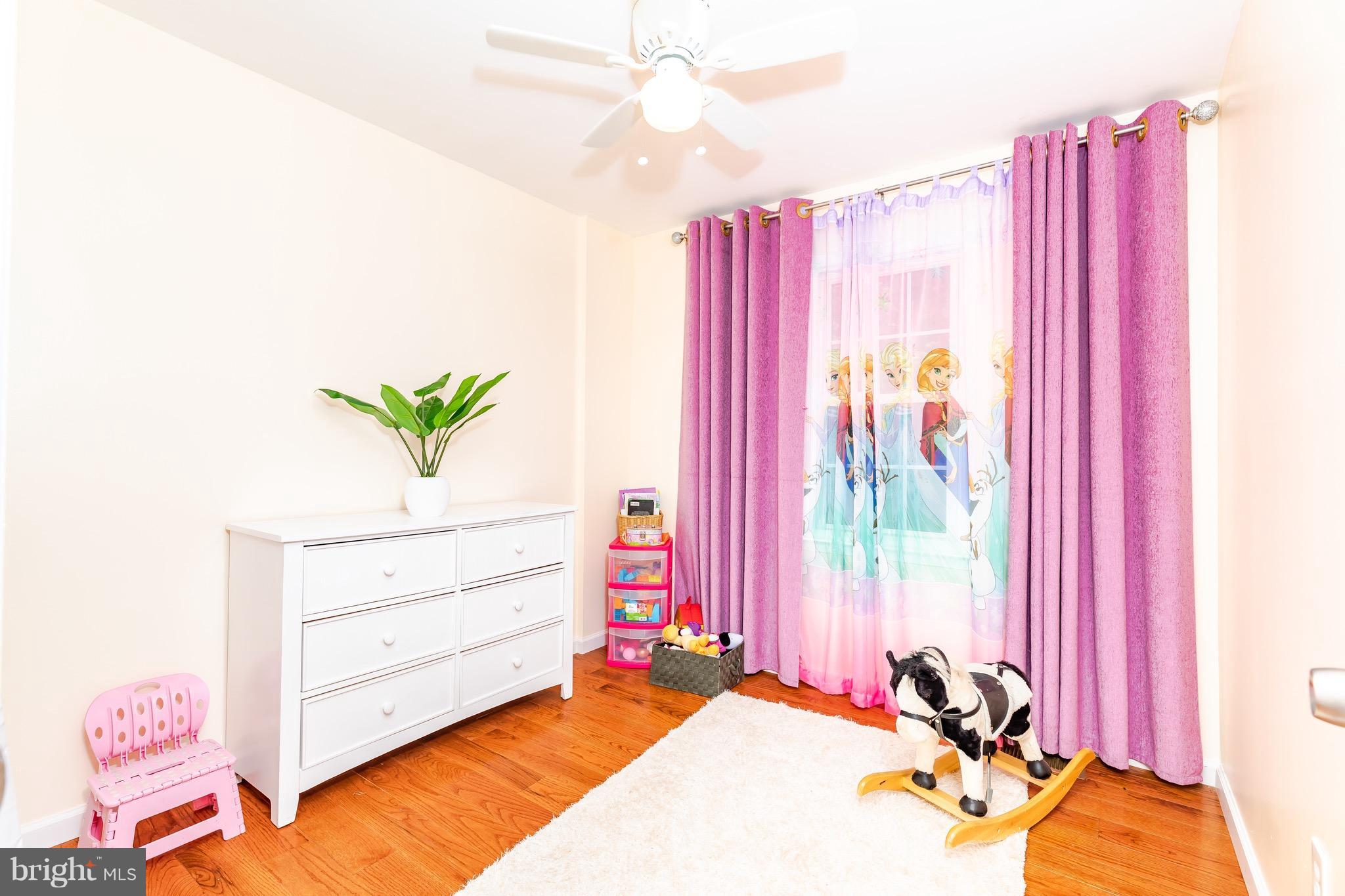 8586 Tyrolean Way Springfield, VA 22153 - Photo 13 of 18 a view of a bedroom with a bed and a window