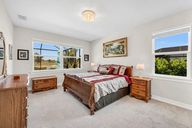 a spacious bedroom with a bed and a window