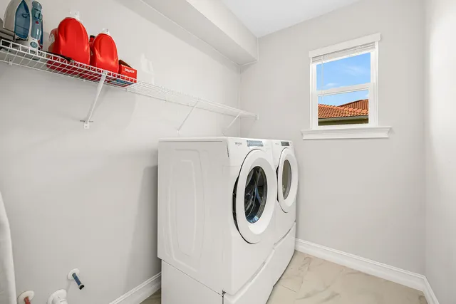 a utility room with dryer and washer