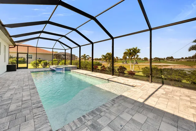 a view of a swimming pool with a porch