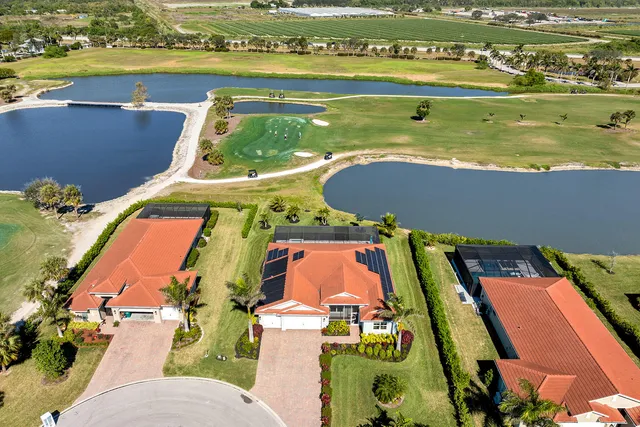 an aerial view of a house with a ocean view