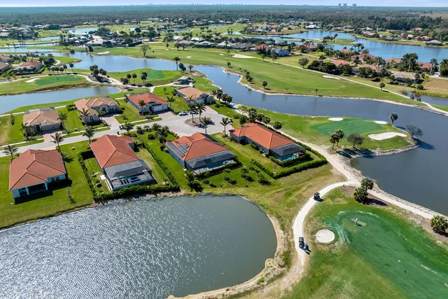 an aerial view of a house with a swimming pool yard and outdoor seating