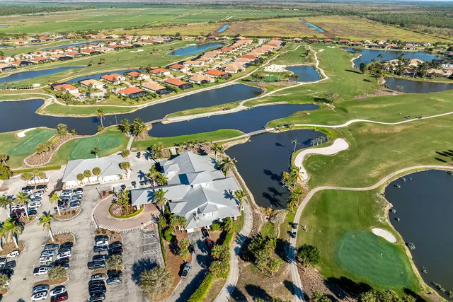 an aerial view of a swimming pool a yard and lake view