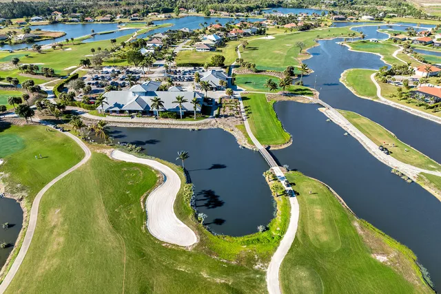 an aerial view of a house with a ocean view