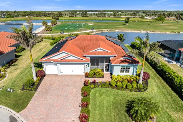 a front view of a building with garden