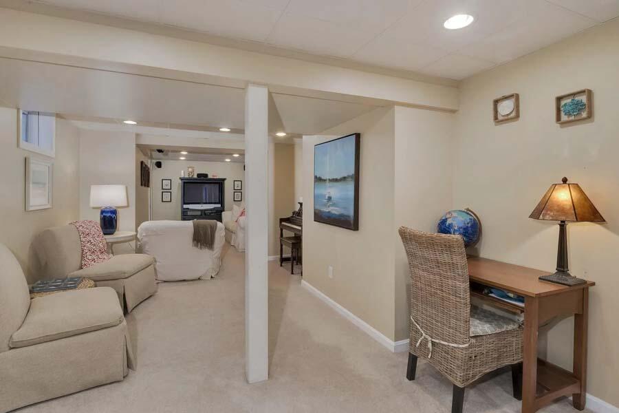 186 Cedric Road Centerville, MA 02632 - Photo 27 of 42 a living room with furniture and a lamp