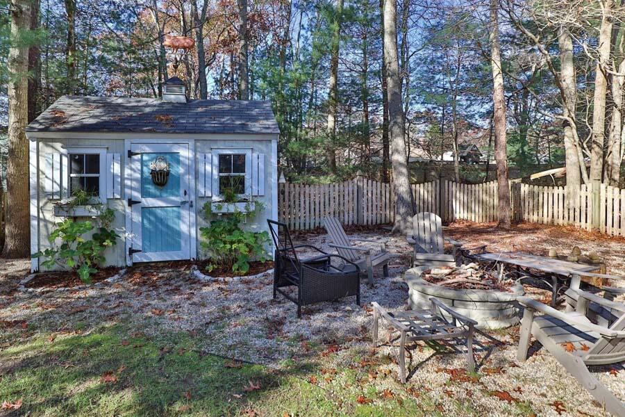 186 Cedric Road Centerville, MA 02632 - Photo 34 of 42 a front view of a house with garden