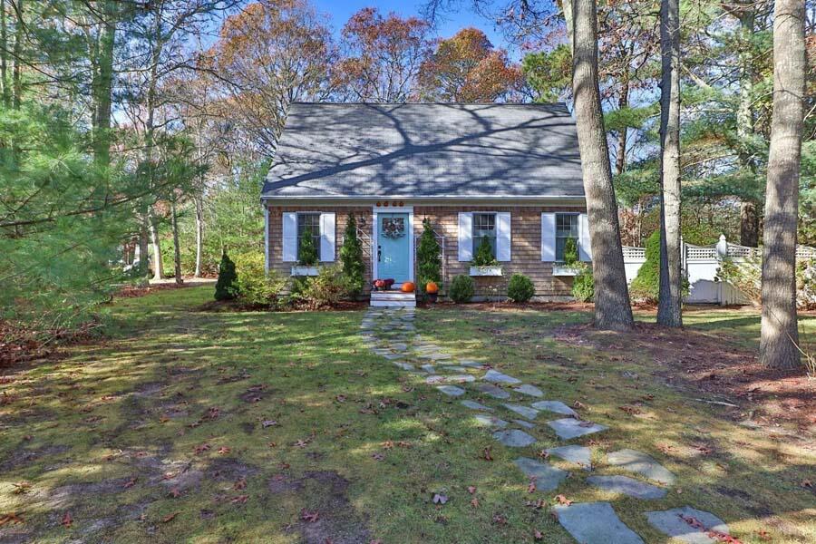 186 Cedric Road Centerville, MA 02632 - Photo 4 of 42 a view of a house with a tree in front of it